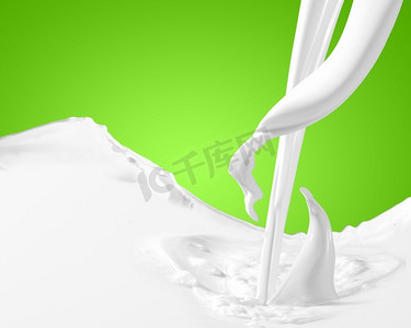 飞溅彩色牛奶牛奶摄影照片_牛奶飞溅的画面。彩色背景下的牛奶溅起的图像