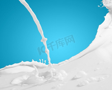 牛奶飞溅的图像。牛奶飞溅的图像对彩色背景