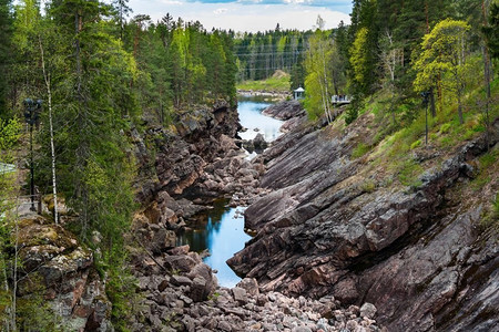 芬兰人摄影照片_伊玛特拉、苏奥米或芬兰。芬兰伊马特拉的沃克萨河和岩石峡谷景观