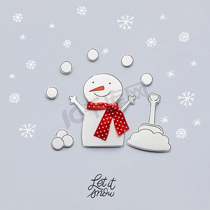 一张纸做的雪人的创意照片，背景是灰色。