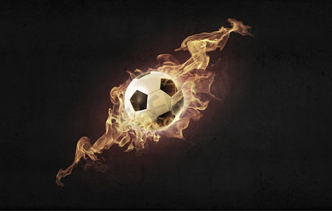 火焰形状摄影照片_好热的球。概念形象的足球在火火焰