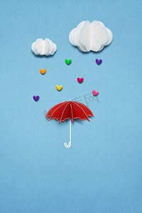 天猫创意双十一海报摄影照片_创意的情人节礼物概念照片，白色背景下的心如雨点般落下。