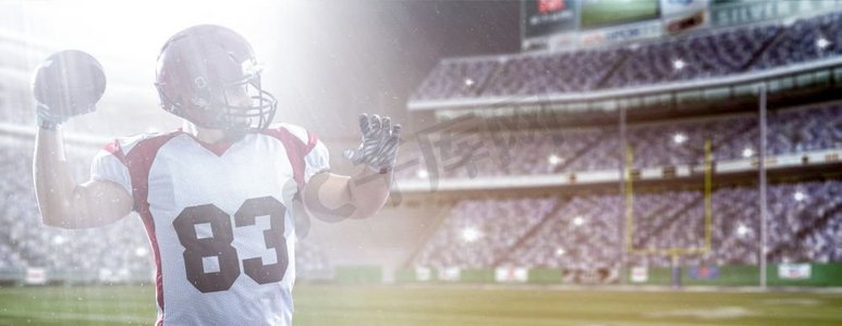 一名四分卫美式橄榄球运动员在大型现代体育场上投球，灯光和照明弹林立