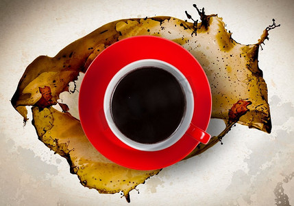 咖啡液体飞溅摄影照片_咖啡时间。近摄的一杯咖啡和飞溅周围