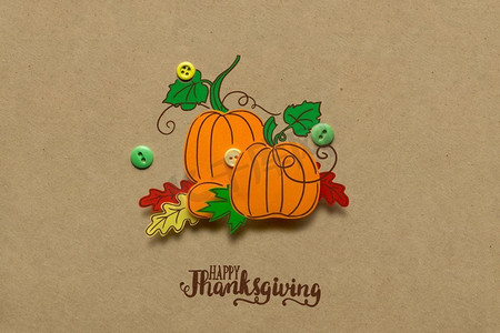 棕色背景纸南瓜创意感恩节概念图。