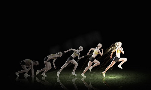 全速前进。年轻女运动员在黑暗背景下跑得很快