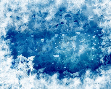 蓝色霜冬季背景与白色雪花