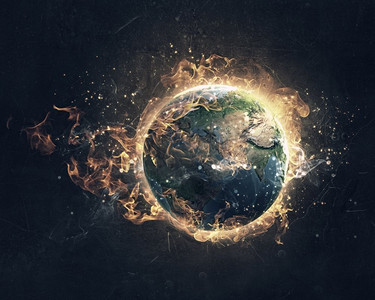 全球灾难概念。燃烧的地球行星在黑暗的背景.这张图片的元素是由美国宇航局提供的