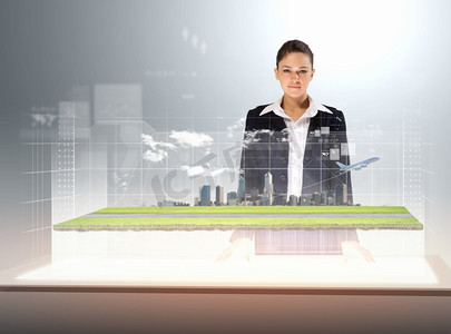 未来科技城市摄影照片_交通和旅行。站在高科技飞机图片前的年轻女商人形象
