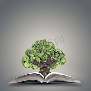 自然机制。绿色概念与树制成的齿轮从书中生长