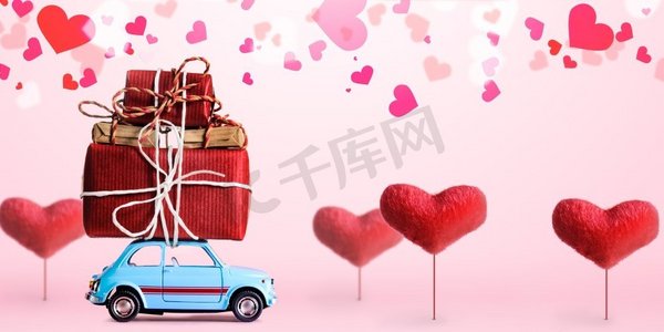 蓝色复古玩具车送情人节礼盒，粉色背景，心形树