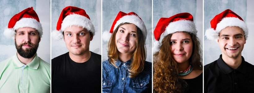 新年五十摄影照片_人们戴着圣诞老人的帽子。一群戴着圣诞帽庆祝圣诞节或新年的人