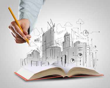 建筑业打开书和手绘建筑草图