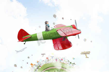 平面女孩摄影照片_年轻有趣的女人在空中飞行在复古飞机。女孩飞行旧飞机