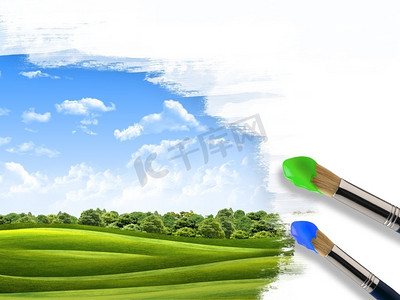 用刷子把风景涂上蓝天绿草。
