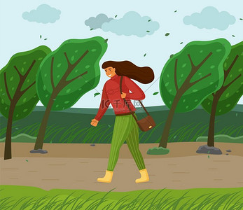 刮风的天气，女人在公园里行走，穿过强风，绿树弯曲，树叶在空中飞舞，棕色长发的年轻女孩，红色保暖毛衣，绿色条纹裤子，肩上的包，靴子。