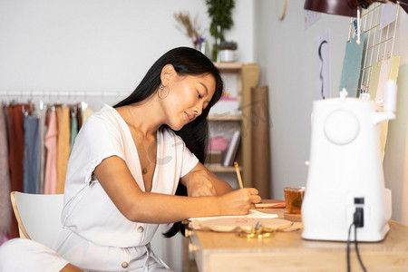 Side View Women Writing Home