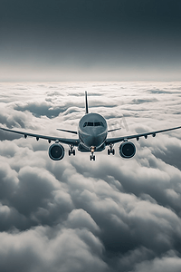 飞机航行摄影照片_客机在云层上飞行航行