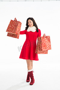 红色喜庆促销新年摄影照片_青年女人新年购物