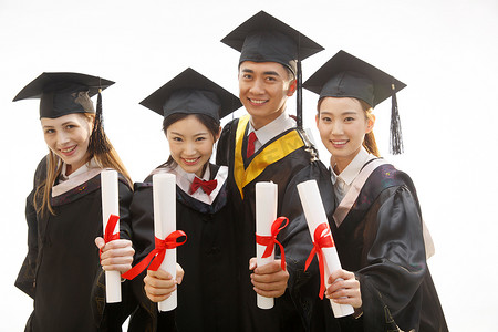 毕业背景摄影照片_大学生穿着学士服庆祝毕业