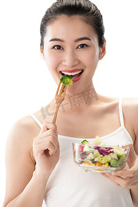 瘦身美女摄影照片_青年女人吃沙拉