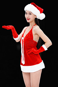 帽托摄影照片_穿圣诞服的年轻女人