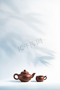 茶道背景摄影照片_竹子背景下的茶壶