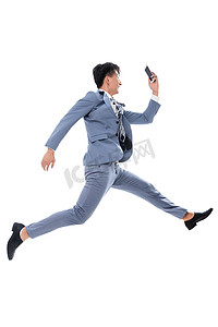 奔跑中的图片摄影照片_拿着手机奔跑跳跃的商务男士
