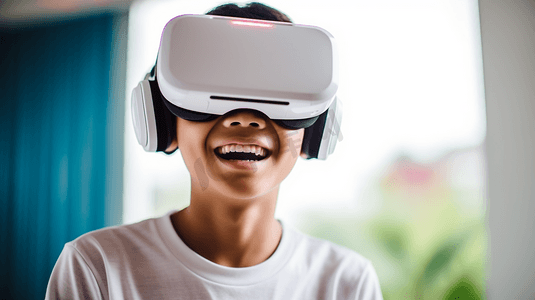 新科技技术摄影照片_一个十几岁的男孩与虚拟现实互动。vr技术和可穿戴技术概念。一个戴着vr眼镜的少年。男孩戴着有技术背景的虚拟现实耳机
