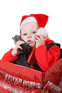 礼盒惊喜摄影照片_圣诞礼盒里的婴儿电话