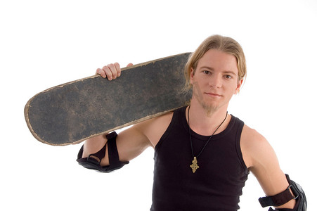 美国帅哥摄影照片_肩上扛着滑板的帅哥