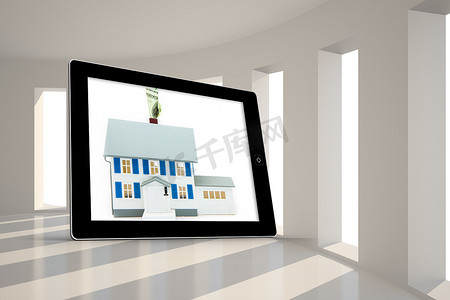 平板电脑屏幕上带有价格标签的房屋合成图像