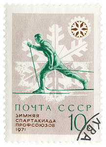 在邮政邮票上跑步的滑雪者