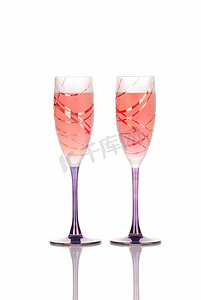 干杯液体摄影照片_两杯玫瑰葡萄酒庆祝用途
