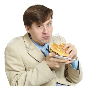 幽默商人在白色背景下吃三明治
