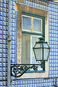 渔民画摄影照片_葡萄牙里斯本传统渔民房屋的旧窗户