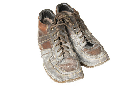 建筑灰尘中的泥泞靴子