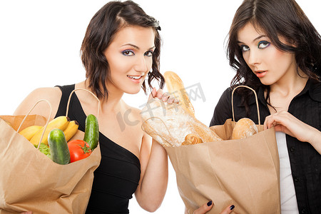 水果商店摄影照片_拿着购物袋杂货的女性