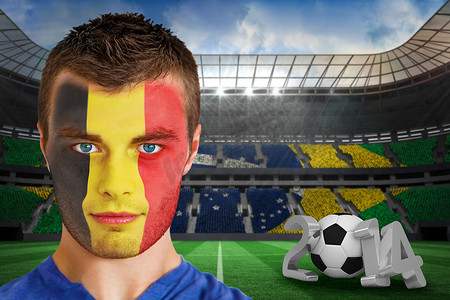 球迷摄影照片_脸上涂着油漆的严肃的年轻比利时球迷
