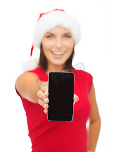 带着智能手机的圣诞老人助手帽微笑的女人