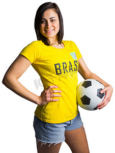 t恤女摄影照片_穿着巴西 T 恤的漂亮足球迷