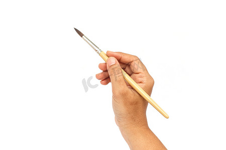 喷绘画笔笔刷摄影照片_手持画笔在白色背景下被隔离