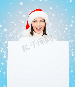 带空白白板的圣诞老人助手帽的女人