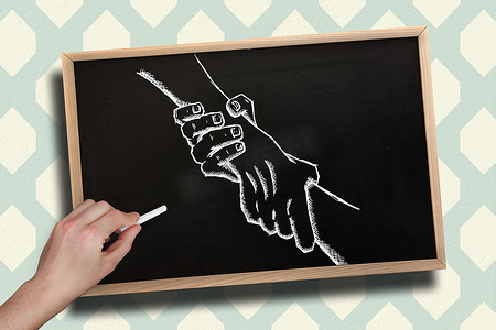 教室黑板手绘摄影照片_手绘握手粉笔的合成图像