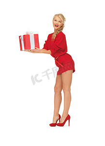 可爱礼物盒子摄影照片_有礼物的红色礼服的可爱的妇女