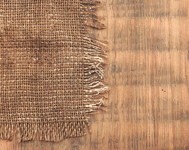 木板上的麻布黄麻帆布复古背景