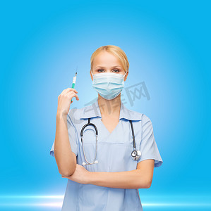 麻醉摄影照片_戴面具的女医生或护士拿着注射器