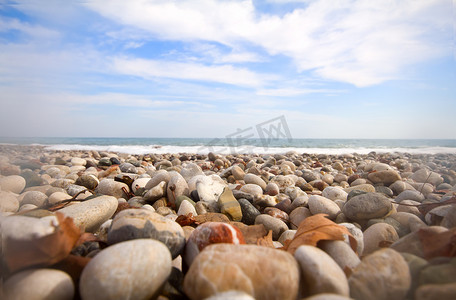 鹅卵石摄影照片_海滩波浪美丽的鹅卵石地中海