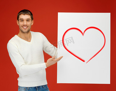 情人节海报摄影照片_拿着大板子的英俊的人有心脏