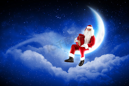 坐在月亮上的圣诞老人照片